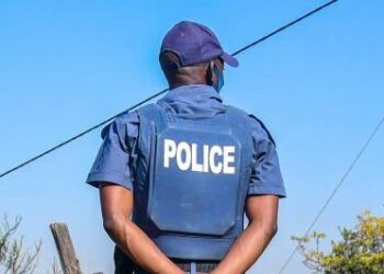 DURBAN, SOUTH AFRICA - JULY 21: Police in Lamontville on July 21, 2020 in Durban, South Africa. It is reported that a group of protesters torched cars at the municipal centre that housed a SASSA office, a clinic, and six state vehicles in anger after residents cut off their illegal connections to the electricity grid in a near-by formal housing settlement. Demonstrators blocked several main roads including the N2 and M4. (Photo by Darren Stewart/Gallo Images via Getty Images)