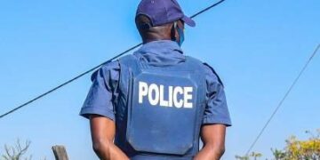 DURBAN, SOUTH AFRICA - JULY 21: Police in Lamontville on July 21, 2020 in Durban, South Africa. It is reported that a group of protesters torched cars at the municipal centre that housed a SASSA office, a clinic, and six state vehicles in anger after residents cut off their illegal connections to the electricity grid in a near-by formal housing settlement. Demonstrators blocked several main roads including the N2 and M4. (Photo by Darren Stewart/Gallo Images via Getty Images)
