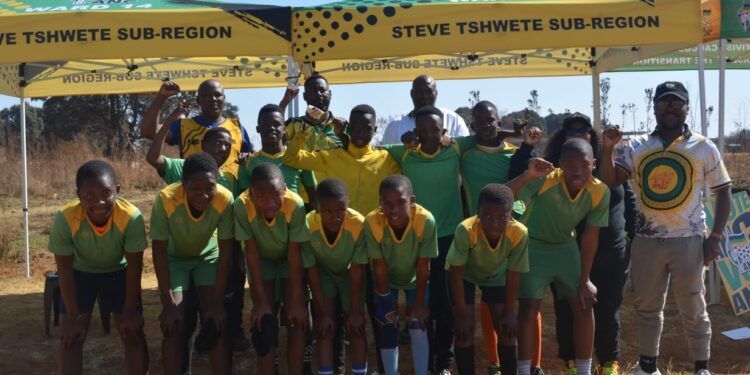 Behind the soccer team (left to right) Ahmed Mahlangu (volunteer), Mhlonishwa Masilela (Steve Tshwete mayor), Sello Matshoga (Nkangala regional secretary), Poppy Msiza (Thembisile Hani municipality speaker) and Sihle Mashilwane (Steve Tshwete council whip)