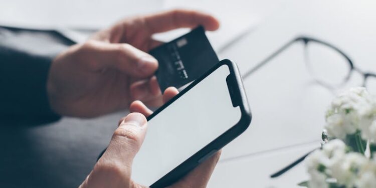 Person Holding Iphone 6 With Red Case