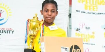 :- Banele Ngwenya (11) from Nelson Ngubeni Primary School is showcasing her trophy and laptop she received after winning the Spelling Bee competition held at Duvha Primary School in Emalahleni.