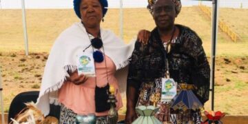 :- Rosina Kabini (left) a craftswoman who designs handmade items from animal skin, wood and raffia is with Betty Mahlangu (right) displaying her crafted unique glass creation.